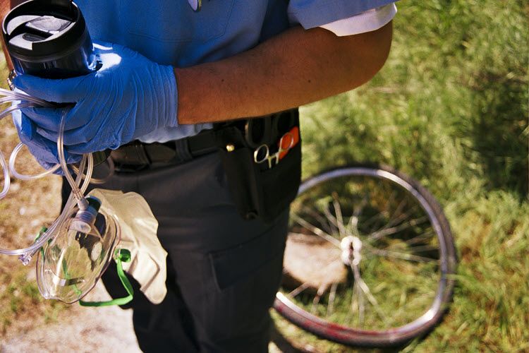 EMS work responds to the scence of a bicycle accident