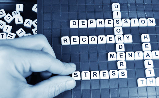 A blue scrabble like puzzle spelling out mental health issues
