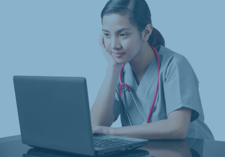 a nurse working on a laptop